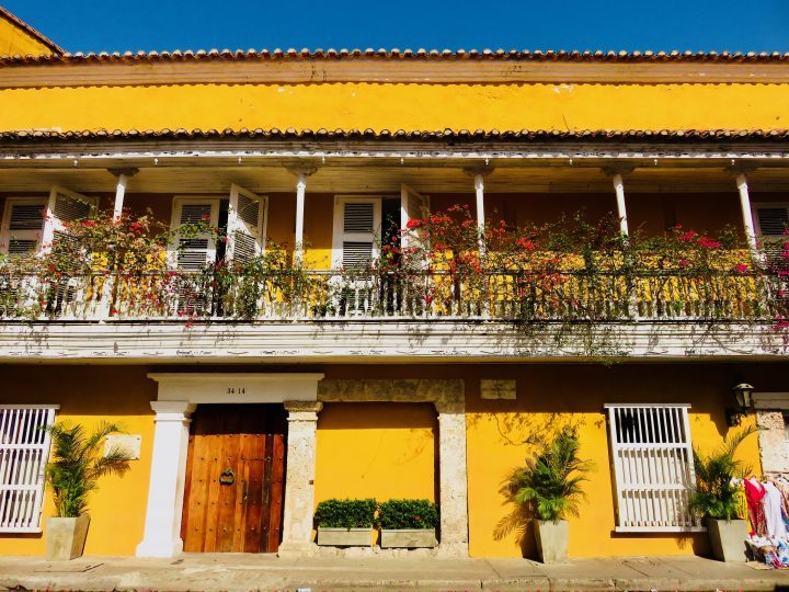Colorful streets with flowers in Cartagena Colombia; Colombia Travel Blog Inspirations